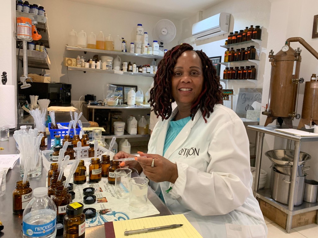 Estelle blending fragrances at a creative workshop