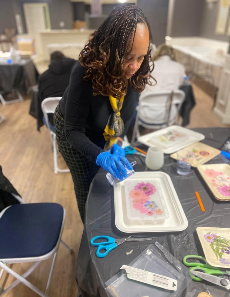 Estelle teaching a resin and pressed flower workshop