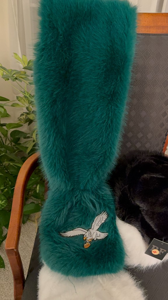 Teal faux-fur coat with an embroidered Philadelphia Eagles patch
